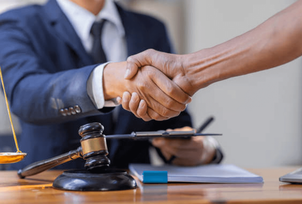 lawyer shaking hands with client